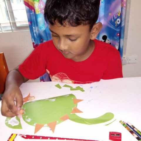 Teacher helping a child write
